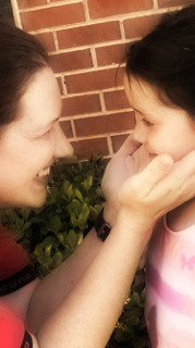 parent holding cheeks of child soft